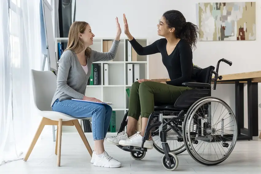 NDIS Support Coordination professional working with a participant in Perth to connect them with services and achieve their goals